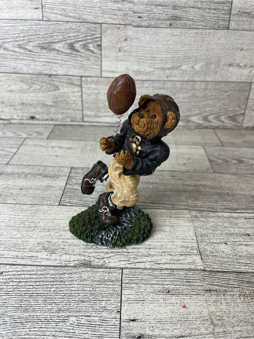 Boyds Bear figurine playing football with a football